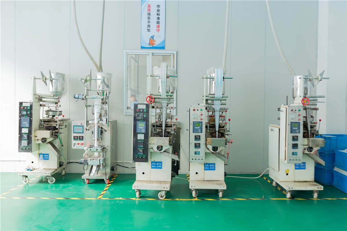Desiccant packet packing machines